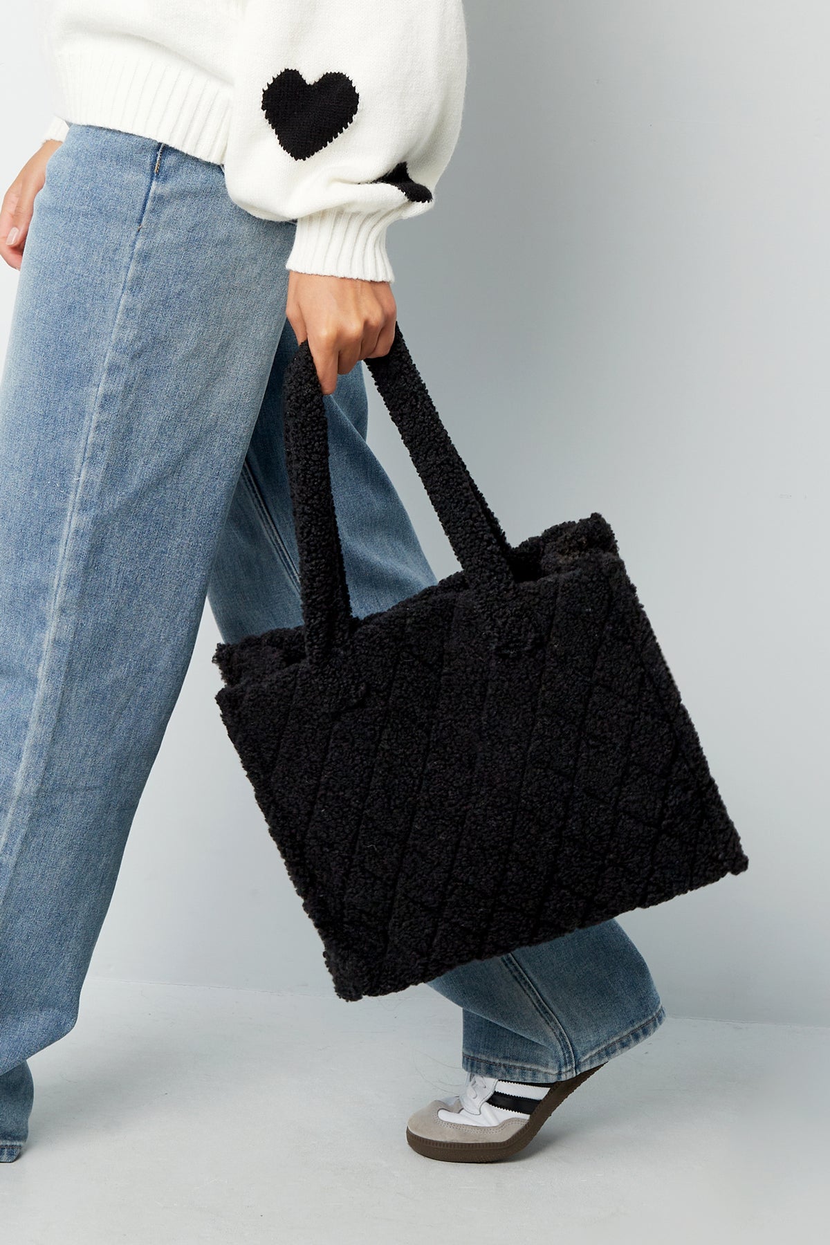 Black Coco tote bag with a soft structured design shown in a styled outfit from Sorea Fashion.