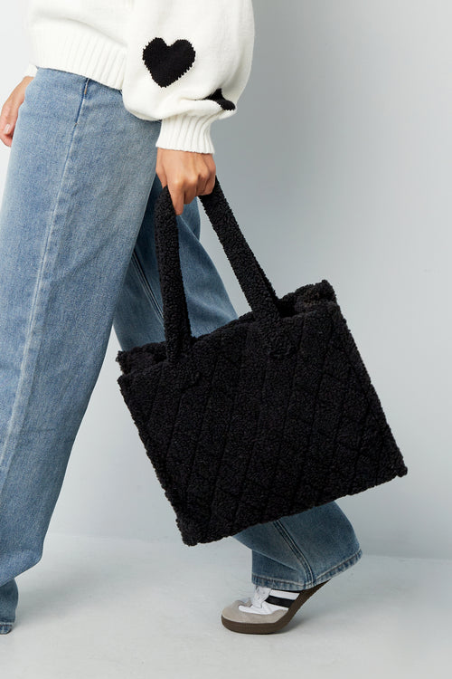 Black Coco tote bag with a soft structured design shown in a styled outfit from Sorea Fashion.