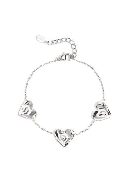 Silver bracelet featuring heart-shaped charms displayed on a white background from Sorea Fashion.