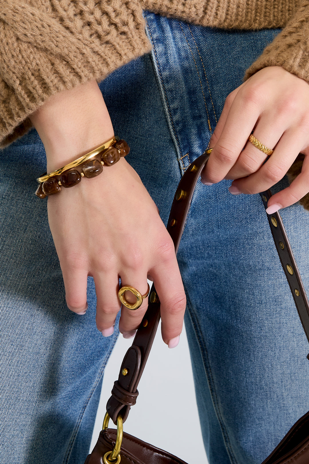 Brown Kaia bracelet with round beads worn stacked on the wrist from Sorea Fashion.