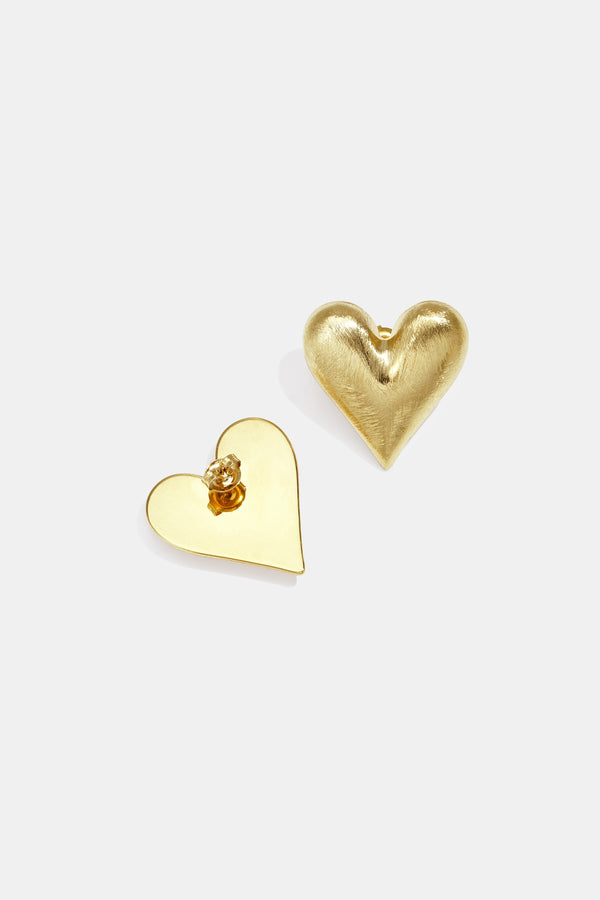 Gold Lia heart-shaped stud earrings displayed on a white background from Sorea Fashion.