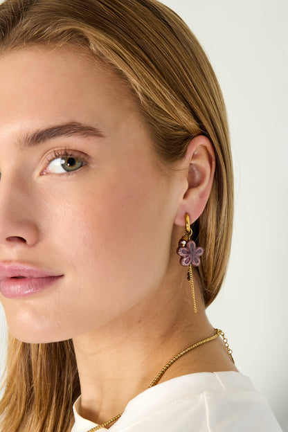 Red and pink Petal earrings shaped like small flowers worn in the ear from Sorea Fashion.