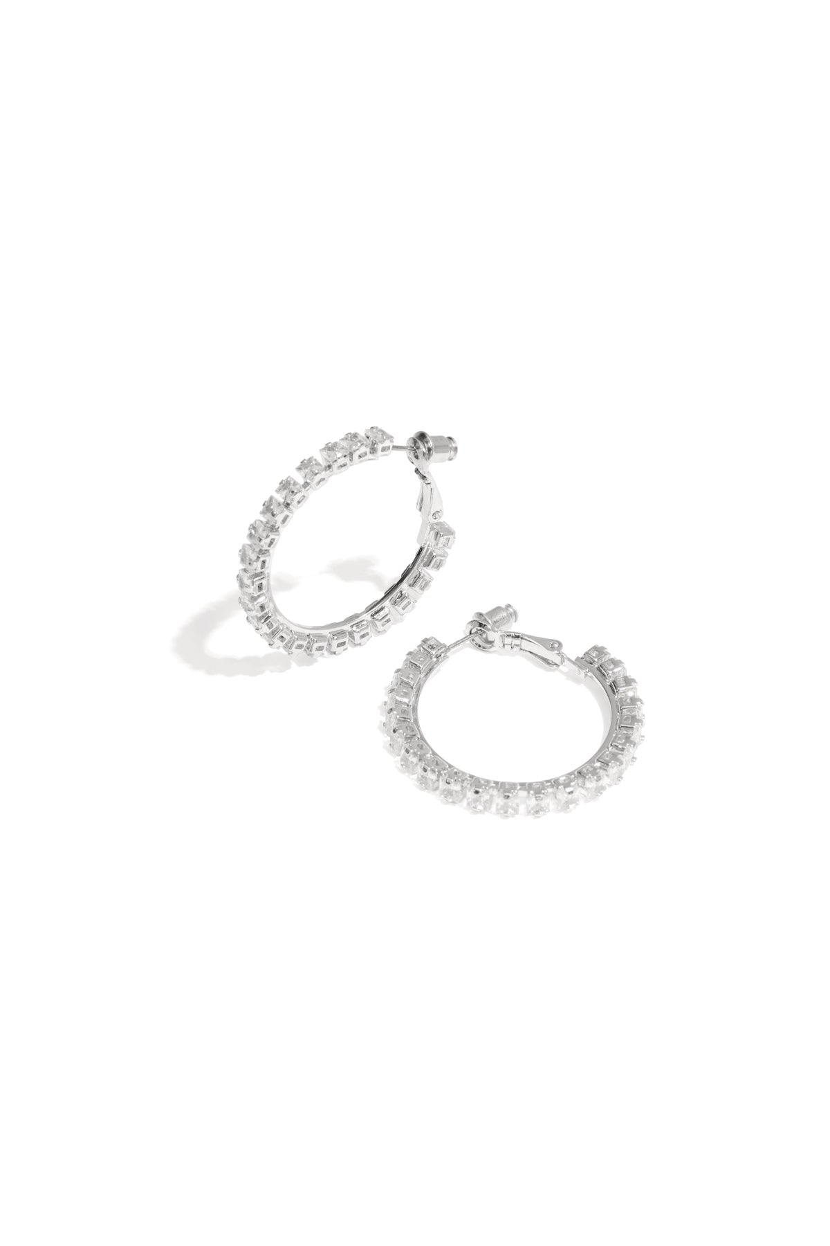 Minimalist silver hoop earrings displayed on a white background, Rina earrings from Sorea Fashion.