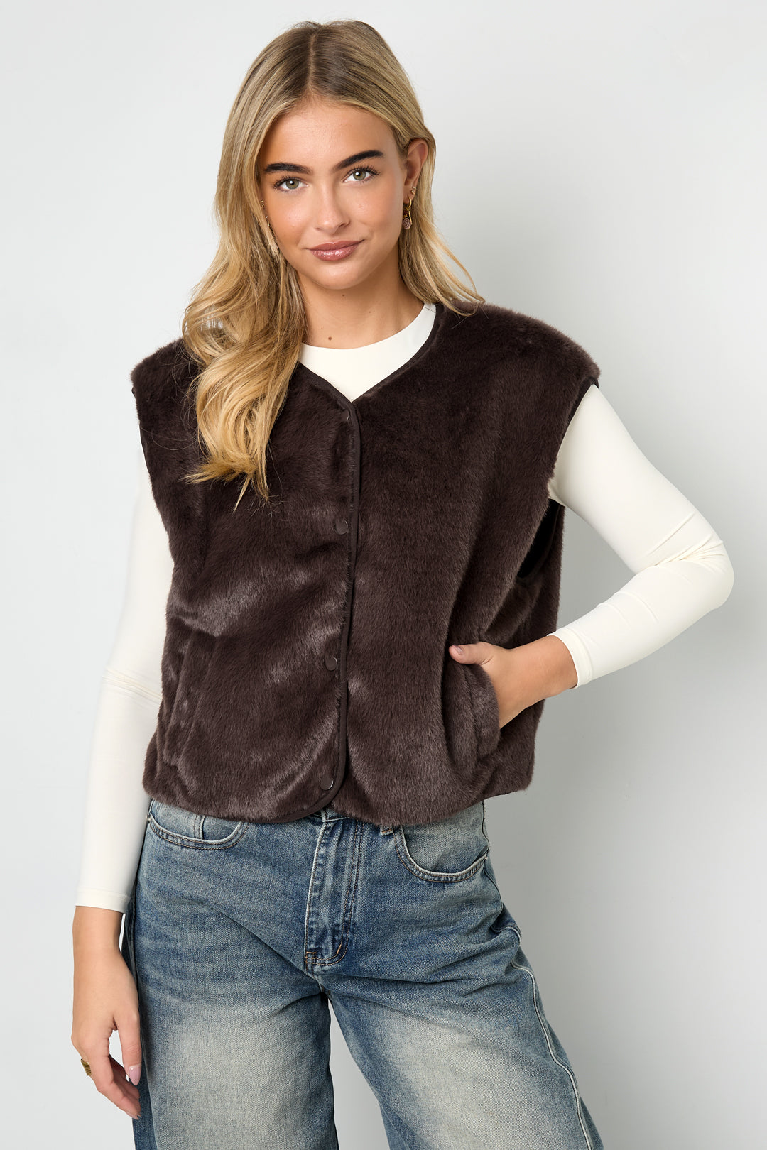 Brown Rylee fluffy faux fur vest styled casually with jeans from Sorea Fashion.